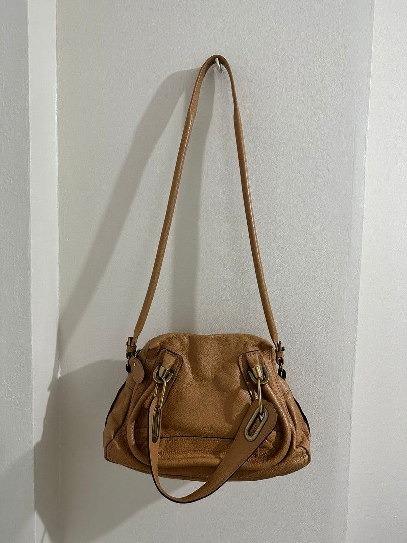 Authentic Chloe Paraty Small (Category: Luxury Bags & Wallets) located in Cainta. Submitted by pastaye (Listing ID 1253738295, Image 1). Description: ** 15.5k for a limited time only!! Preloved Chloe Paraty small Two-way handbag with sling Excellent used condition (no noticeable flaw, no corner rubs, with light marks due to the metal hardware in the strap - see photo) With card and holo is intact RFS: Decluttering (and eyeing a new bag ☺️) MOP: G