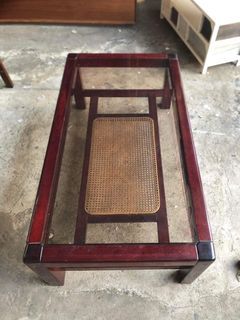 Glass top solid wood and rattan center table  44L x 24W x 15H inches In good condition Code akc 438