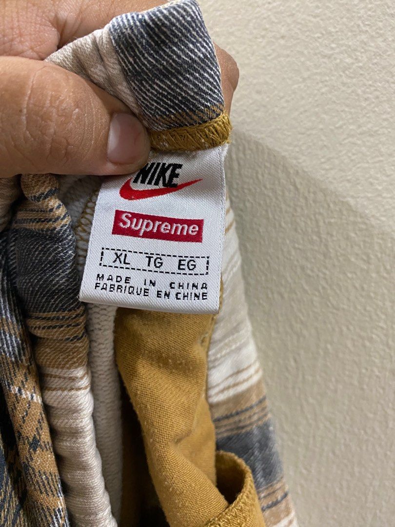 Supreme nike plaid shorts discount