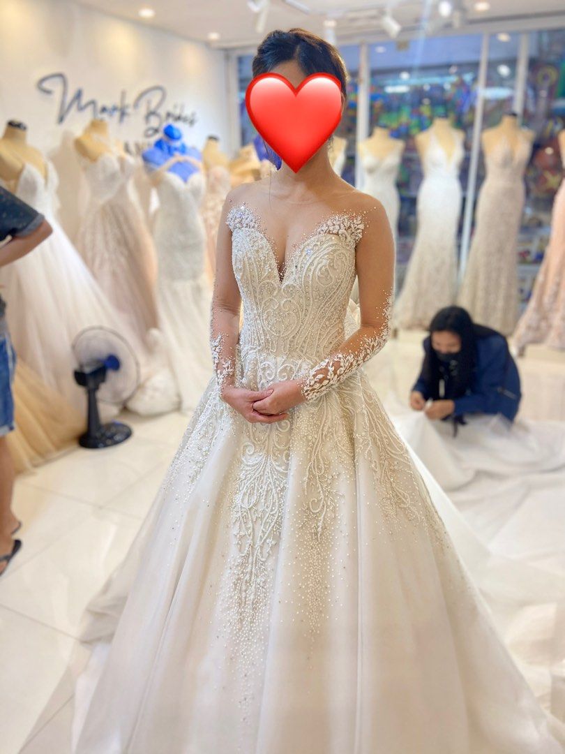 Wedding Gown Mark Brides (Category: Evening dresses & gowns) located in Manila. Submitted by angel1791 (Listing ID 1253862772, Image 2). Description: Bought 40k. Small but adjustable on back. With detachable ribbon at back With inclusions: Pillows, veil and cord.
