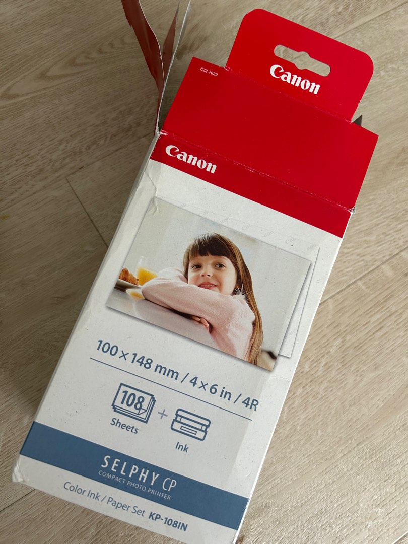 how to put paper in canon selphy printer