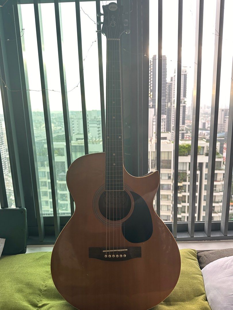 GB A acoustic guitar with built in tuner and extra set of strings