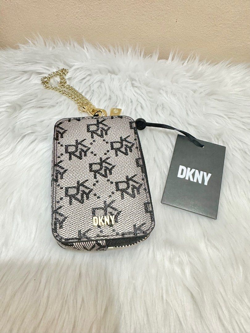 Original DKNY Sidney Zip Around Card Pouch (Category: Wallets & Card holders) located in Las Pinas. Submitted by anasonlineshophtplaspinas (Listing ID 1275663025, Image 1). Description: Original DKNY Sidney Zip Around Card Pouch Dimenstions: 4.25” H, 2.75” L, .75” W Zipper closure DKNY logo at front Removable chain 100% PVC with leather trim Origin: Imported.