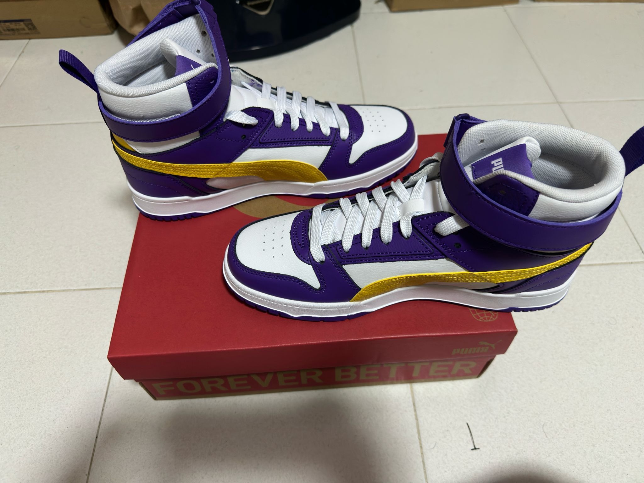 Purple and gold pumas on sale