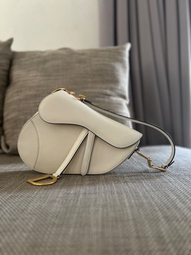 SALE! Authentic Dior Medium Saddle Bag Grained Leather White (Category: Luxury Bags & Wallets) located in Makati City. Submitted by kbernalcloset (Listing ID 1275691458, Image 1). Description: Comes with original dust bag.