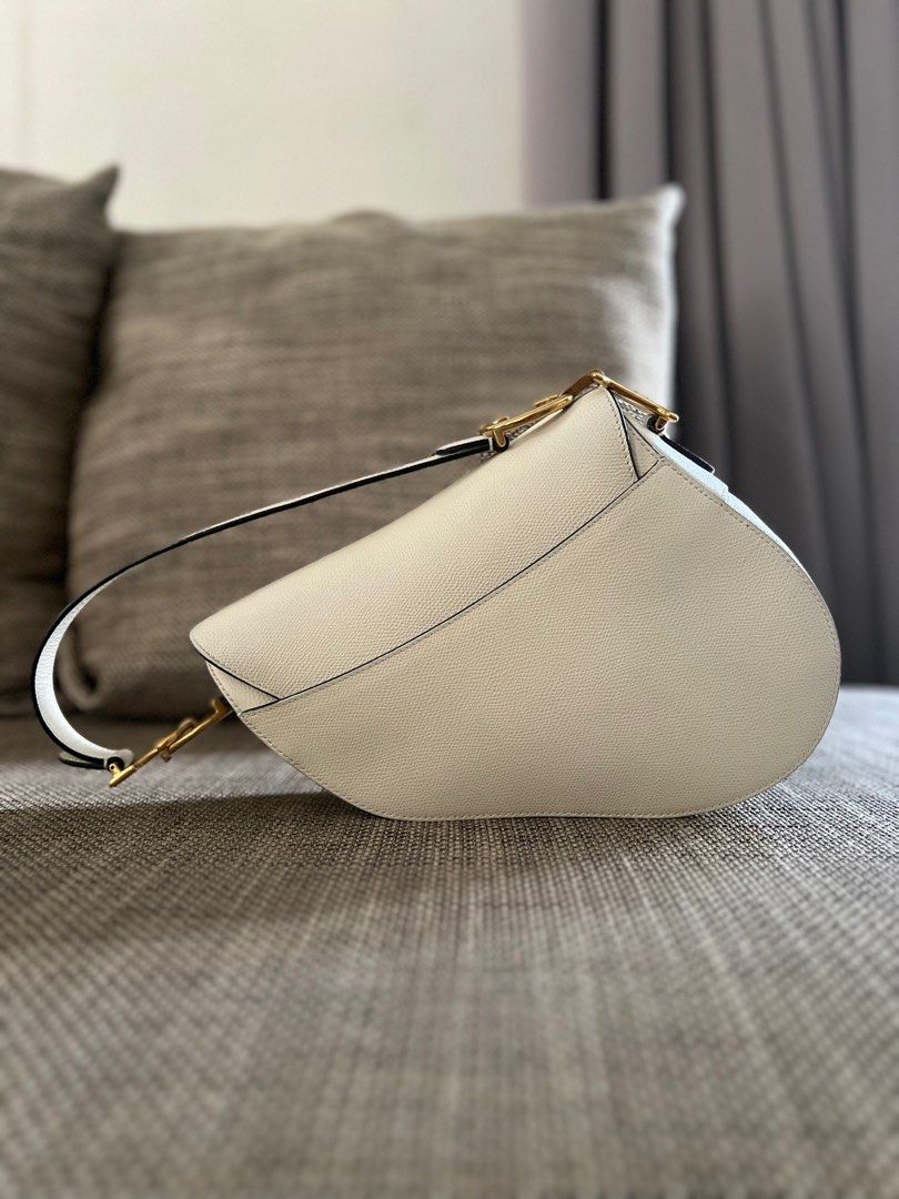 SALE! Authentic Dior Medium Saddle Bag Grained Leather White (Category: Luxury Bags & Wallets) located in Makati City. Submitted by kbernalcloset (Listing ID 1275691458, Image 2). Description: Comes with original dust bag.