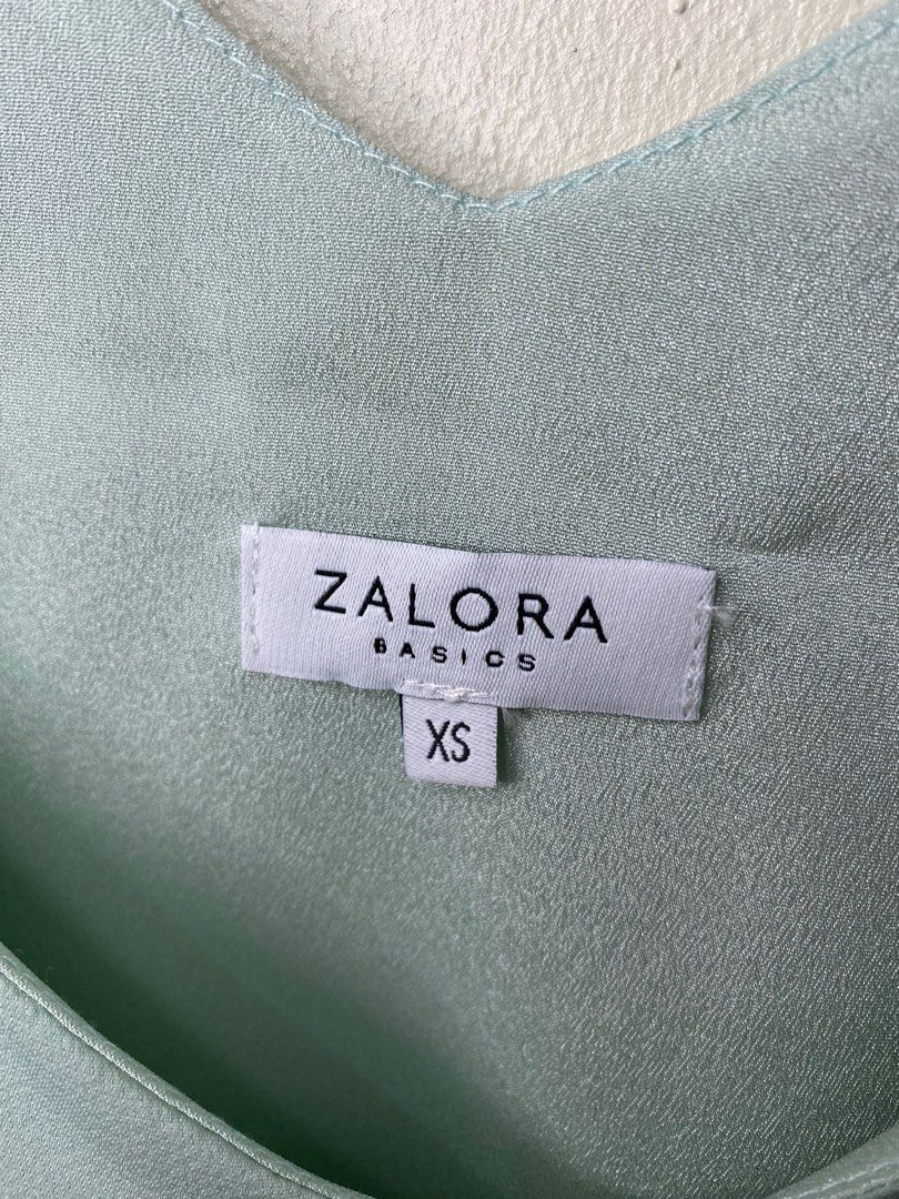 Sleeveless Sage Green Top (XS) (Category: Sleeveless) located in Quezon City. Submitted by perrywinkle_ (Listing ID 1275746923, Image 3). Description: Sizing runs one size bigger (since be size of this top is XS, it can fit S-M body frames).