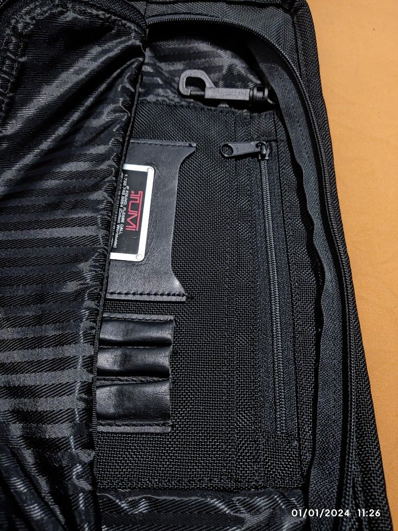 Tumi Laptop/Portfolio Large Pouch Bag (Category: Laptop Bags & Sleeves) located in Antipolo. Submitted by fantazma_23 (Listing ID 1275663132, Image 3). Description: Tumi Laptop/Portfolio Large Pouch Bag Good for 15-17in Laptops and Documents Very Good Condition Minimal fades on Zippers and Leather No hidden issues/holes/tears/stains Already cleaned Vintage Tumi Made in USA Tumi Tracer can be registered to new owner (see last 2 pix) Width: 16 inch