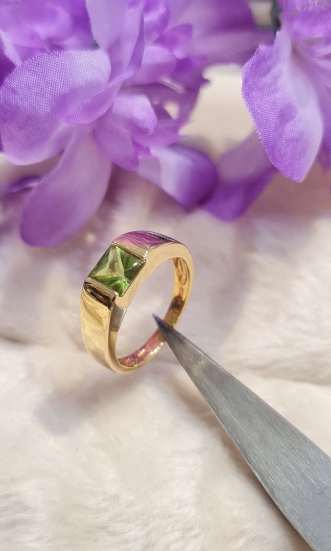 Gold ring deals with purple stone