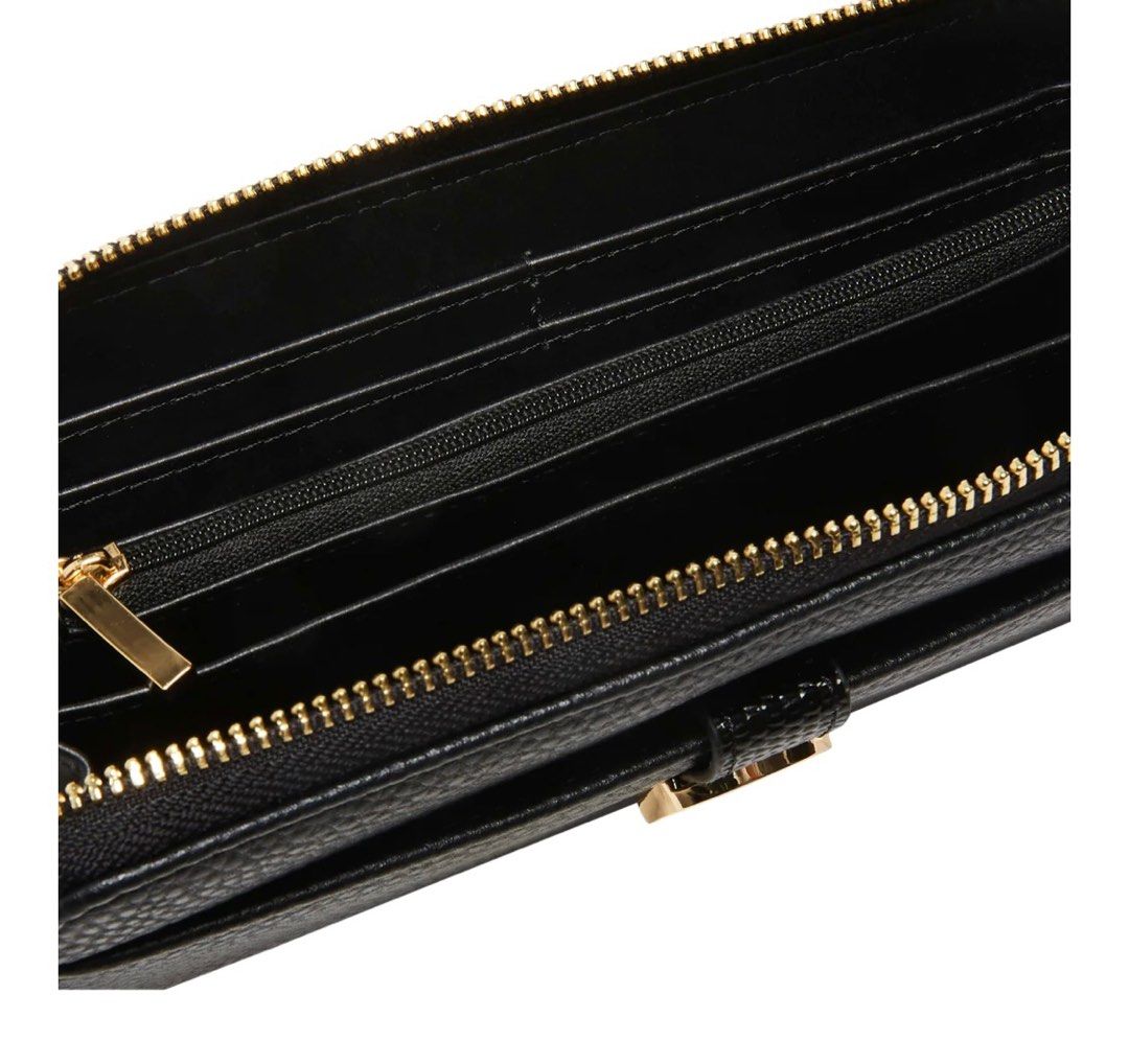 Anne Klein (Category: Luxury Bags & Wallets) located in Del Monte. Submitted by loryelletee (Listing ID 1278518450, Image 3). Description: 💚 Anne Klein Zip Around Wallet 💚Brand new with tag 💚100% Authentic 💚Freah from U.S 💚On Hand 💚Php 1,700 💚DESCRIPTION This AK zip around wallet has subtle brand detailing which doubles as a closure for the front slip pocket. This wallet also has plenty of organization functionality including a center zip 