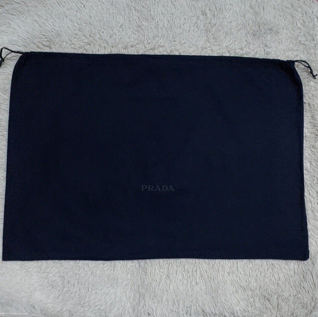 Authentic Prada dust bag 18.5x27 inches (Category: Luxury Bags & Wallets) located in Manila. Submitted by jfluxury.co (Listing ID 1278507295, Image 2). Description: excellent condition no flaws bought in Japan 🇯🇵 💯% Authentic. 😊 Money back guarantee. 😊 Clean and ready to use na po.