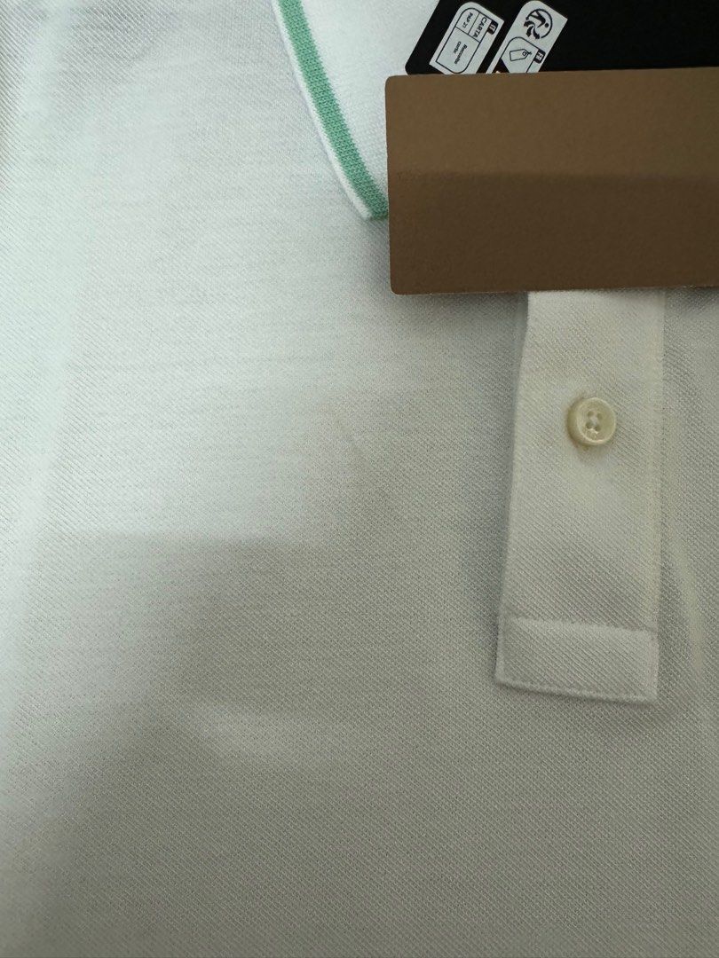 Boss White Polo Shirt (Category: Tshirts & Polo Shirts ) located in Manila. Submitted by invinoveritas.670 (Listing ID 1278541209, Image 3). Description: Boss White Polo Shirt XL on tag but can fit XXL Issue: May stain na strike dun right side, nadumihan nung pinapack. Pero matatangal naman po yan pag nilabhan. Slightly negotiable. .