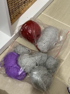 Mix of unused and used skeins of yarn for crocheting