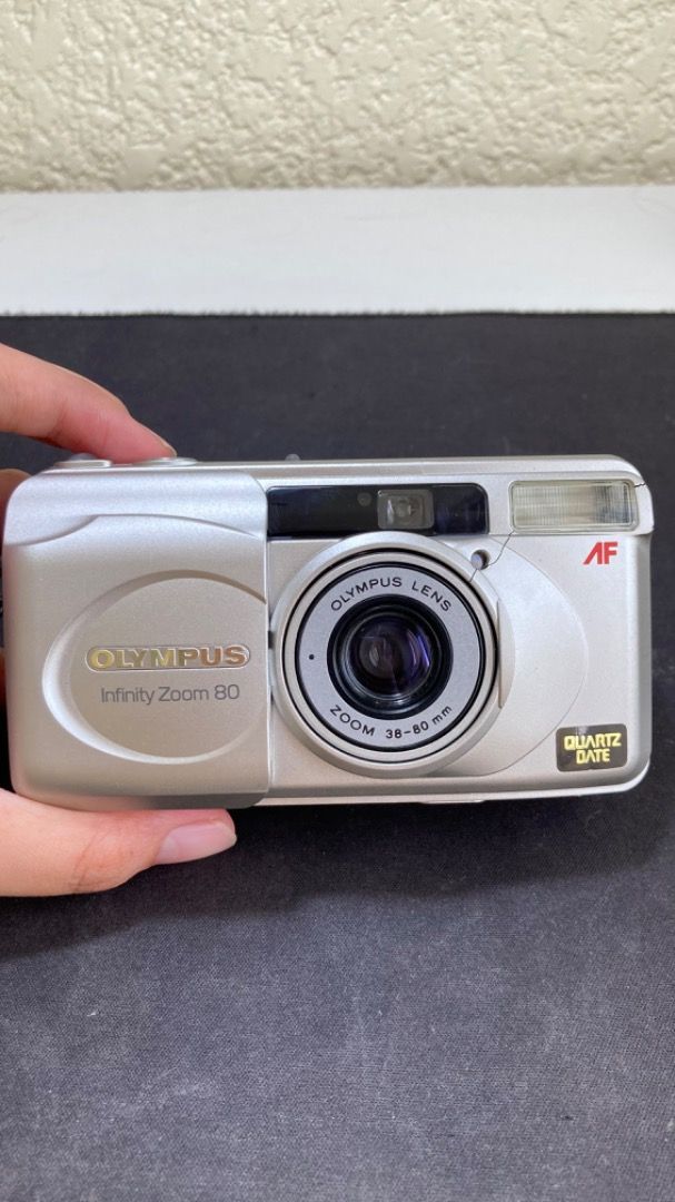 Olympus Infinity Zoom 80 QD (Category: Cameras) located in Antipolo. Submitted by thriftmsandrist (Listing ID 1278502637, Image 1). Description: Olympus infinity zoom 8035 mm point & shoot film camera Untested, Selling as is Might need repairing so buy at your own risk Unit only *No sample pics since i never used it Body cosmetics 6/10 Has scratches and cracks Unit only with original strap No return/refund MOP: Gcash or Bank transfer MOD: J&T, La