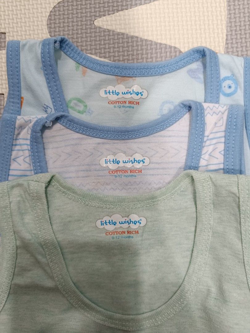 3 pcs Cotton Sando + Free Shirt (Category: Babies & Kids Fashion) located in San Fernando. Submitted by absiti (Listing ID 1278876497, Image 2). Description: 3 pcs Cotton Sando + Free Shirt Size: 9 to 12 months Color: Green, White and Blue (Printed) Brand new and washed! Nakalimutan ipasuot hanggang hindi na kasya kay baby :( With free dinosaur shirt (barely used).