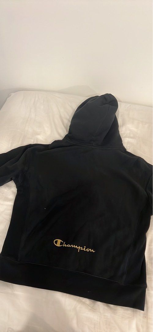 Black champion hoodie with gold 2024 writing