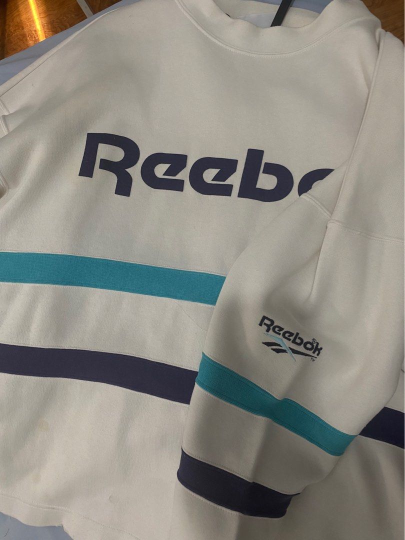 Reebok Sweater (UNISEX) (Category: Coats, Jackets and Outerwear) located in Manila. Submitted by de.clutterthings (Listing ID 1278738376, Image 1). Description: comfy sweater *✲ﾟ*｡ • size: S-M (can be oversized for size S; im an S) • perfecf in cold weathers! • rfs: decluttering! • don’t mine the beige collar underneath the sweater. naka hanger lang sila :) •flaws: not noticeable. (see last pic) .