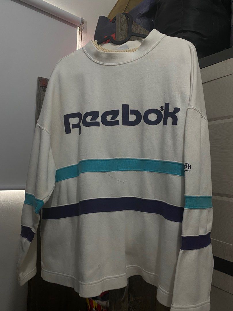 Reebok Sweater (UNISEX) (Category: Coats, Jackets and Outerwear) located in Manila. Submitted by de.clutterthings (Listing ID 1278738376, Image 2). Description: comfy sweater *✲ﾟ*｡ • size: S-M (can be oversized for size S; im an S) • perfecf in cold weathers! • rfs: decluttering! • don’t mine the beige collar underneath the sweater. naka hanger lang sila :) •flaws: not noticeable. (see last pic) .