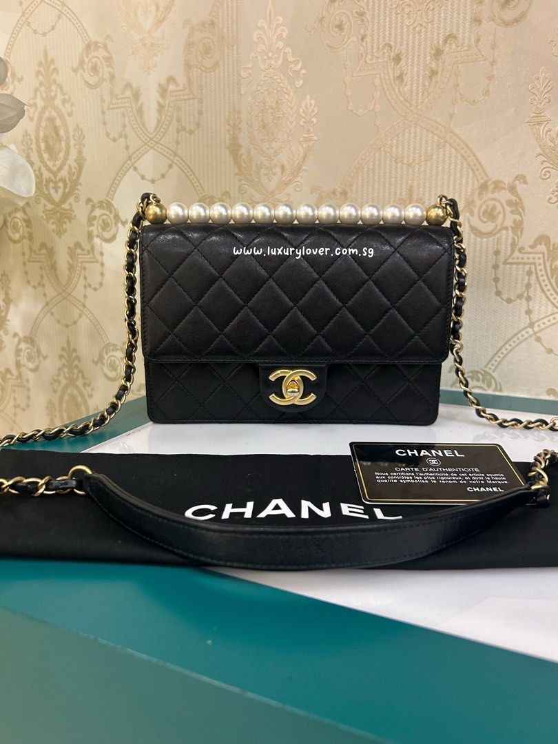 Chanel pearl flap bag top