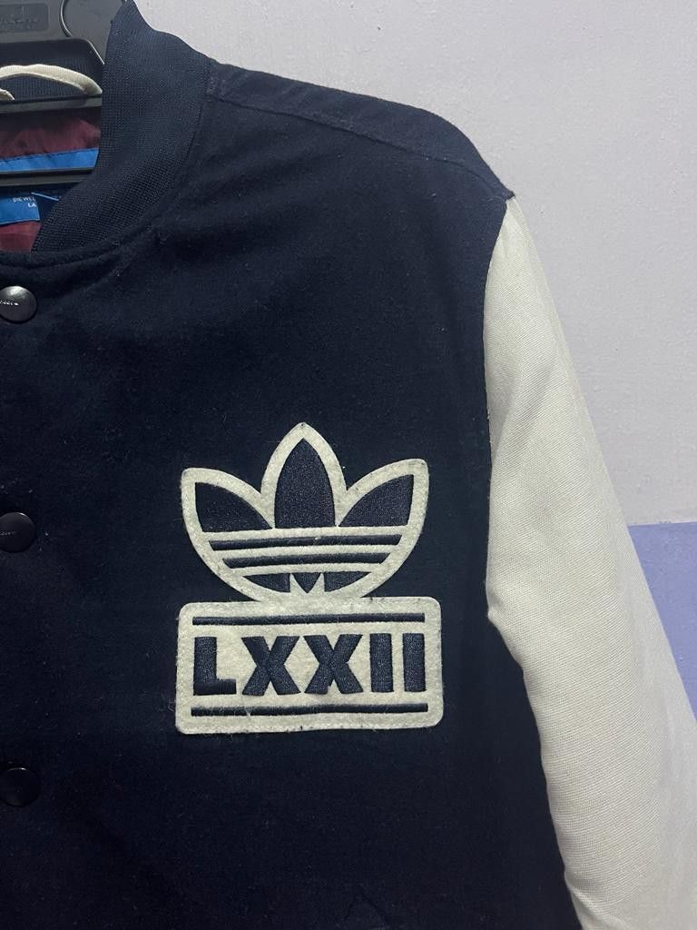 Adidas originals badge varsity jacket discount