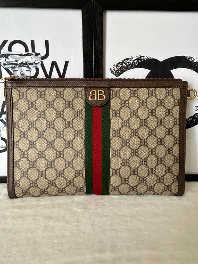 Gucci The Hacker Project Clutch (Category: Luxury Bags & Wallets) located in Manila. Submitted by bagislifeshop (Listing ID 1279115930, Image 2). Description: ☑️Available in Pampanga ✅Condition: 9/10 ✅Material: Coated canvas and antique ghw ✅Size: 30 X 20 X3CM ✅Inclusion: Dustbag, cards and box .