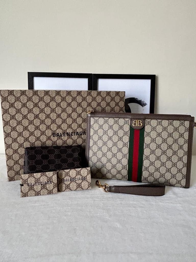 Gucci The Hacker Project Clutch (Category: Luxury Bags & Wallets) located in Manila. Submitted by bagislifeshop (Listing ID 1279115930, Image 1). Description: ☑️Available in Pampanga ✅Condition: 9/10 ✅Material: Coated canvas and antique ghw ✅Size: 30 X 20 X3CM ✅Inclusion: Dustbag, cards and box .