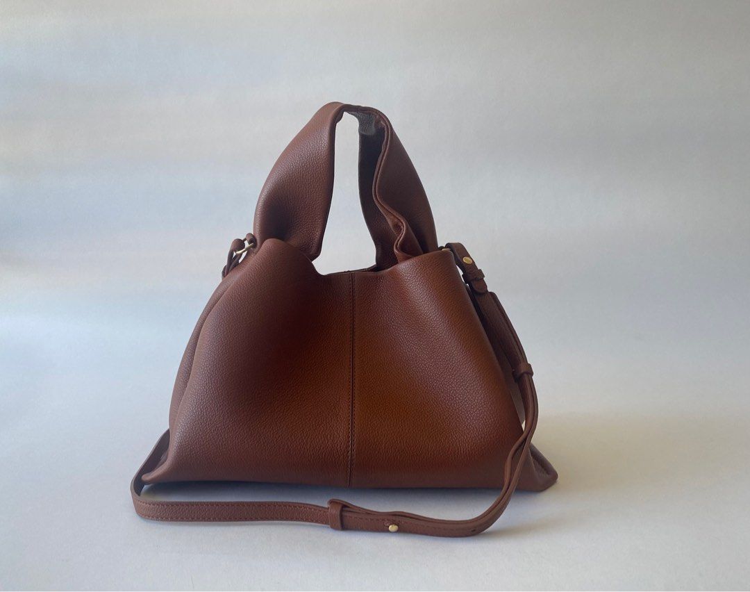 BRANDNEW POLENE NUMERO NEUF COGNAC (Category: Luxury Bags & Wallets) located in Taguig. Submitted by sweetluxuryph (Listing ID 1279481952, Image 2). Description: 💯 GUARANTEED AUTHENTIC ✨38,000✨ Organic Design Strikes Right Balance Between Elegant, Flexibility and Hold Cognac- Designer Colour Soft Textured Calfskin Leather Hand-made, Hand-stitching Dimensions-12.5”x8”x” Top Handle Drop-5” Adjustable & Detachable Strap Comes with Receipt, Tag, Dus