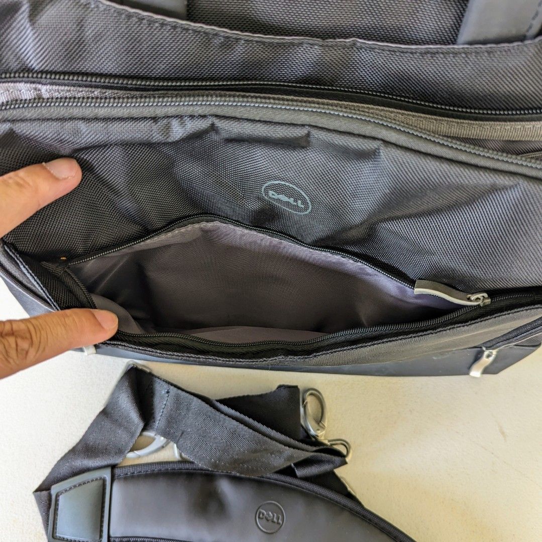Dell Laptop Bag ( 4 zippered pockets) (Category: Laptop Bags & Sleeves) located in Cainta. Submitted by almurk (Listing ID 1279272481, Image 2). Description: Selling slightly used Dell Laptop Bag / Briefcase Excellent organizing features with 4 zippered pockets plus extra pockets and luggage pass through. RFS: Decluttering.