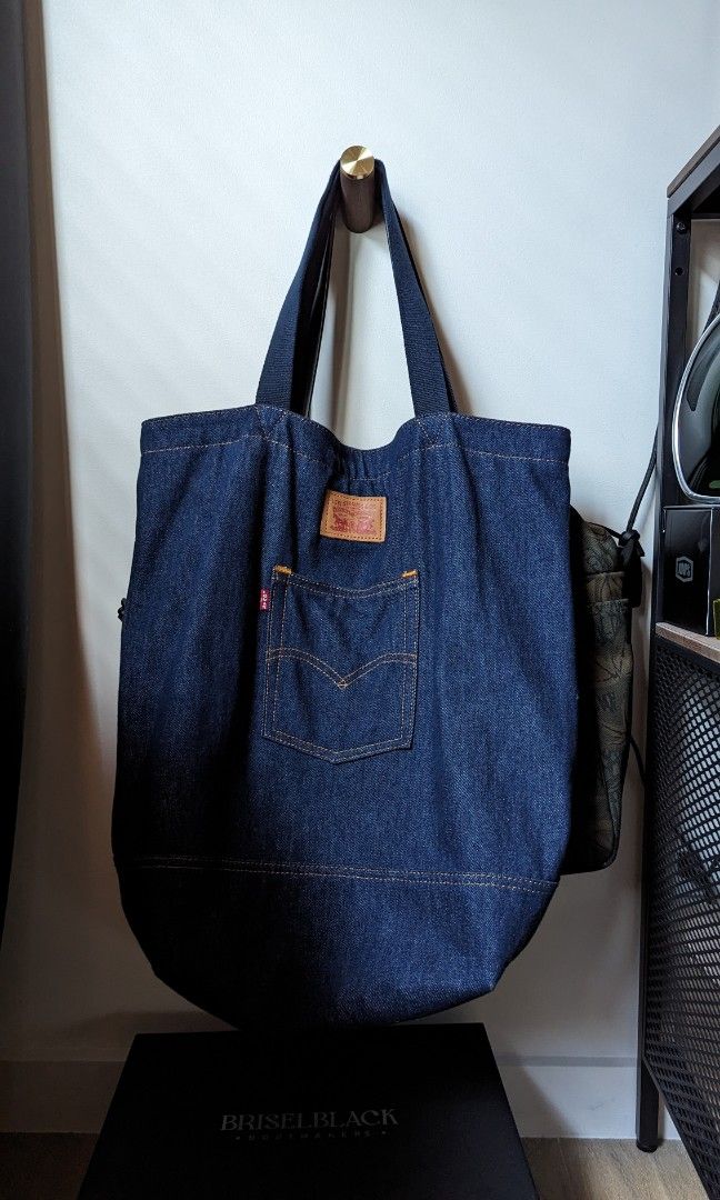 LEVI'S DENIM TOTE BAG Front Pocket Leather Patch (Category: Tote Bags) located in Pasay City. Submitted by bottomdrawermnl (Listing ID 1279350906, Image 3). Description: LEVI'S DENIM TOTE BAG - 17.5" x 18" - small interior pocket in white cloth - Leather Patch and back pocket detail - used four times mostly carrying an ipad and clothes - never been washed - Color: 10/10 like new - no issues with stitching/fraying DM is 🔑.
