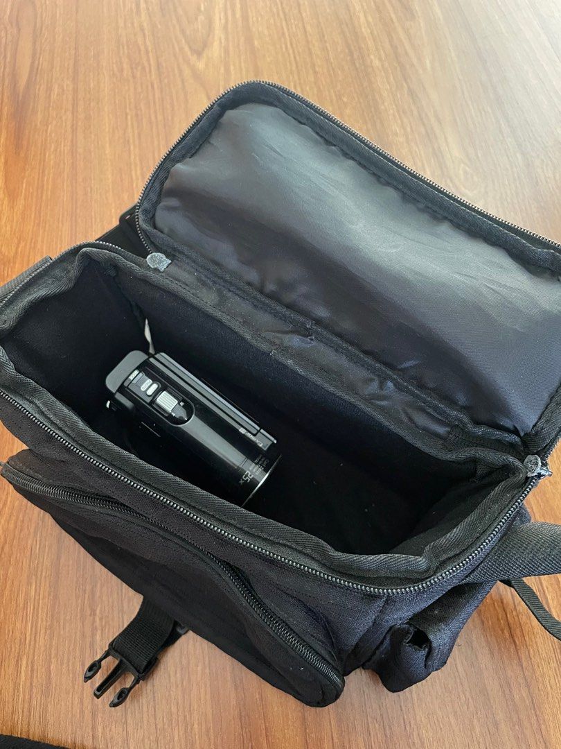 Messenger Type Camera Bag (Category: Camera Bags & Carriers) located in Paranaque City. Submitted by denise__99 (Listing ID 1279304046, Image 3). Description: Insides are clean! Exterior is just a bit dusty from storage but in perf condition Has a hard insert for the structure of the bag. Spacious See handycam inside for refeeence Has an outside compartment. Front and both sides.