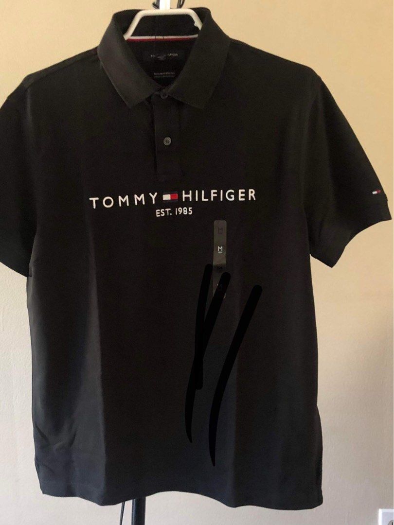 Tommy Hilfiger Polo Shirt (Category: Tshirts & Polo Shirts ) located in Quezon City. Submitted by andreijames (Listing ID 1279422303, Image 3). Description: Tommy Hilfiger Polo Shirt Brandnew and Original with paperbag Sizes Navy Blue: M Black: M White: M.