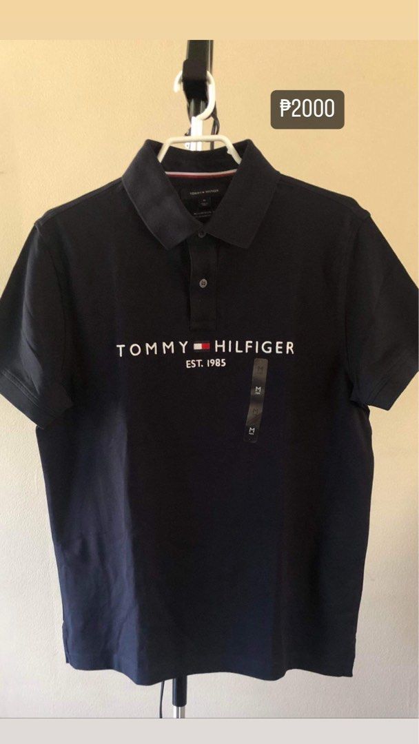 Tommy Hilfiger Polo Shirt (Category: Tshirts & Polo Shirts ) located in Quezon City. Submitted by andreijames (Listing ID 1279422303, Image 1). Description: Tommy Hilfiger Polo Shirt Brandnew and Original with paperbag Sizes Navy Blue: M Black: M White: M.