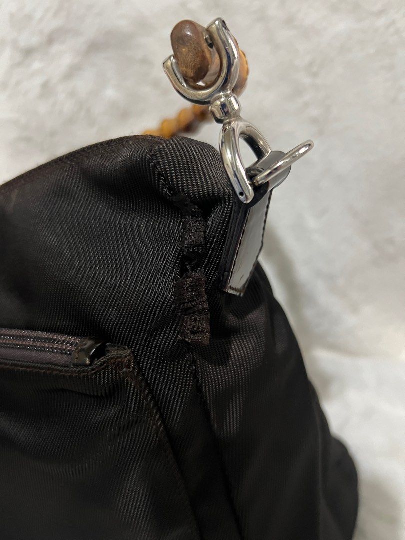 💯 Authentic Gucci Bamboo Nylon Shoulder Bag Small to Medium (Category: Luxury Bags & Wallets) located in Paranaque City. Submitted by authentic_mj (Listing ID 1279601706, Image 3). Description: 💯 Authentic Gucci Bamboo Nylon Shoulder Bag Small to Medium Preloved Authentic from Japan with original card Issue: holes near handle joints.