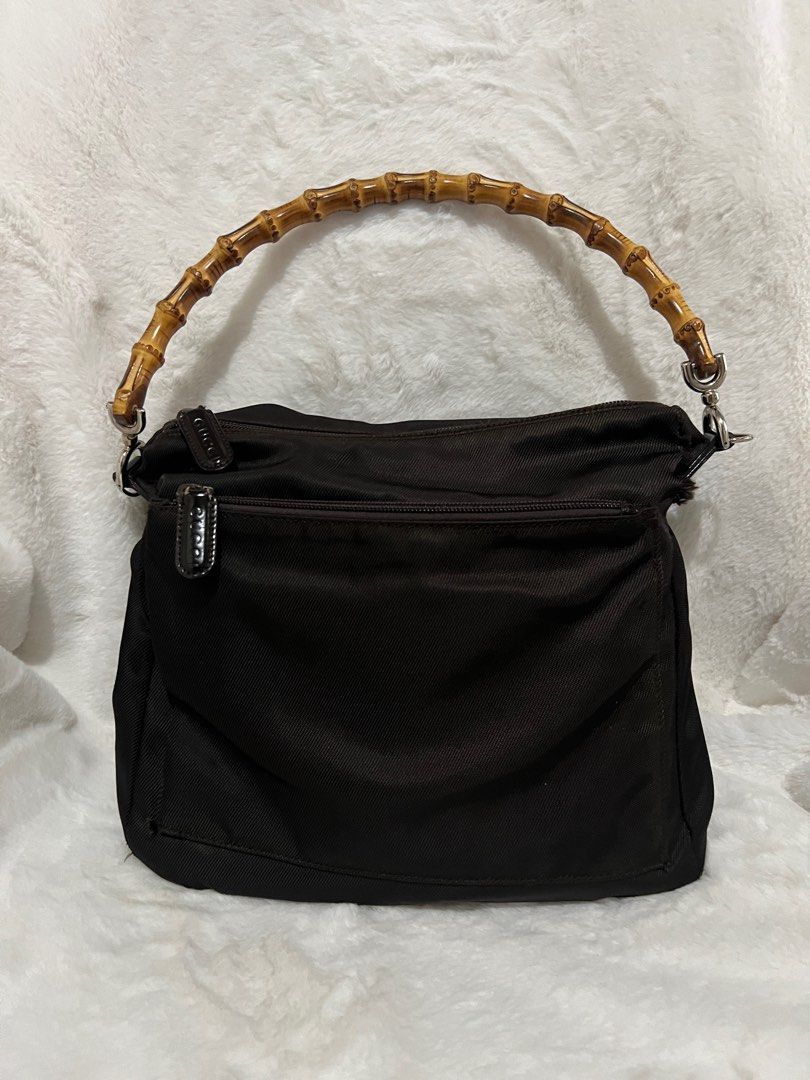 💯 Authentic Gucci Bamboo Nylon Shoulder Bag Small to Medium (Category: Luxury Bags & Wallets) located in Paranaque City. Submitted by authentic_mj (Listing ID 1279601706, Image 2). Description: 💯 Authentic Gucci Bamboo Nylon Shoulder Bag Small to Medium Preloved Authentic from Japan with original card Issue: holes near handle joints.