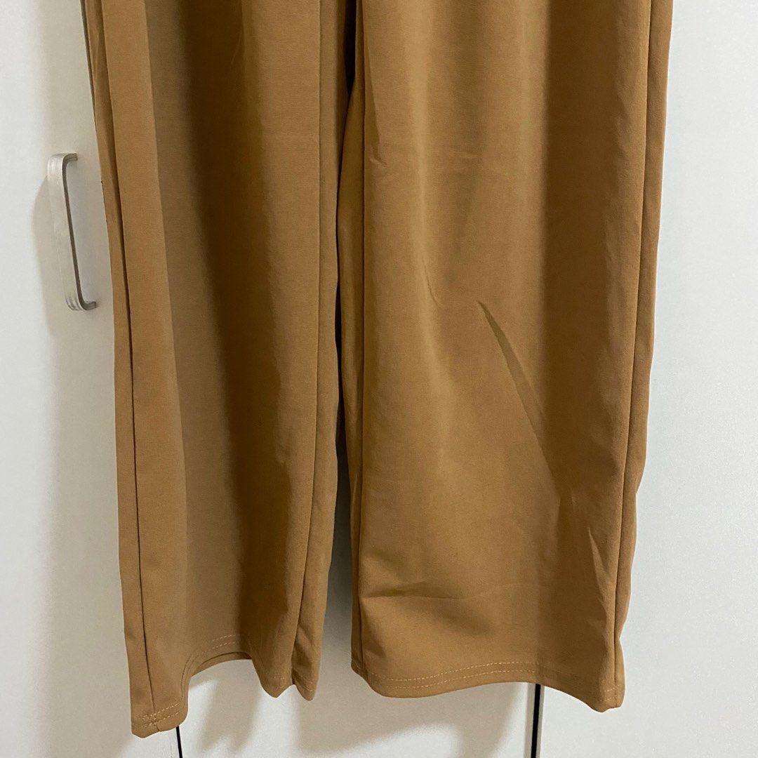 Brown Straight Cut Formal Slacks Pants for Work (Category: Other Bottoms) located in Cavite. Submitted by dashishop (Listing ID 1279687856, Image 3). Description: Never used. I don’t like the color. Bought in Tiktok Shop. Claims to be freesize but i think only up to US 38.