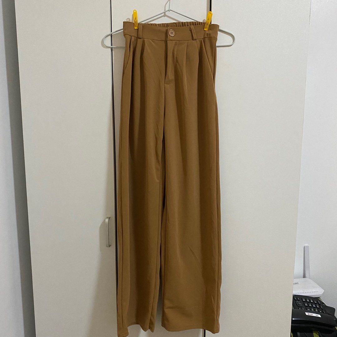Brown Straight Cut Formal Slacks Pants for Work (Category: Other Bottoms) located in Cavite. Submitted by dashishop (Listing ID 1279687856, Image 1). Description: Never used. I don’t like the color. Bought in Tiktok Shop. Claims to be freesize but i think only up to US 38.