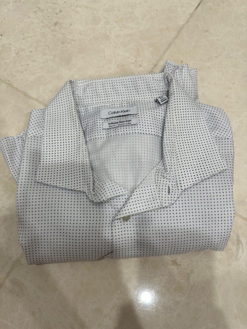Calvin Klein Infinite Non Iron Work Shirt, Men's Fashion, Tops & Sets,  Shirts on Carousell