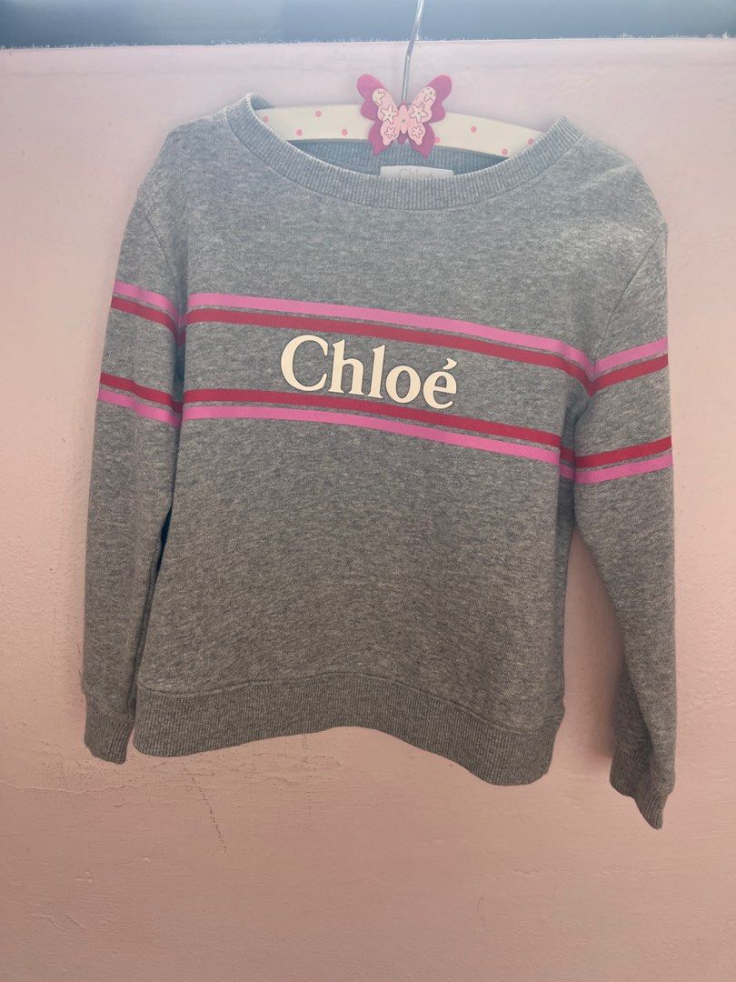 Chloe sweater (Category: Babies & Kids Fashion) located in Singapore. Submitted by m_w_a (Listing ID 1279559677, Image 1). Description: Worn twice before my girl outgrown it. Very beautiful piece from Chloe. Bought it at $300+, letting go at only $50 now. Self collect near BT Timah CC.
