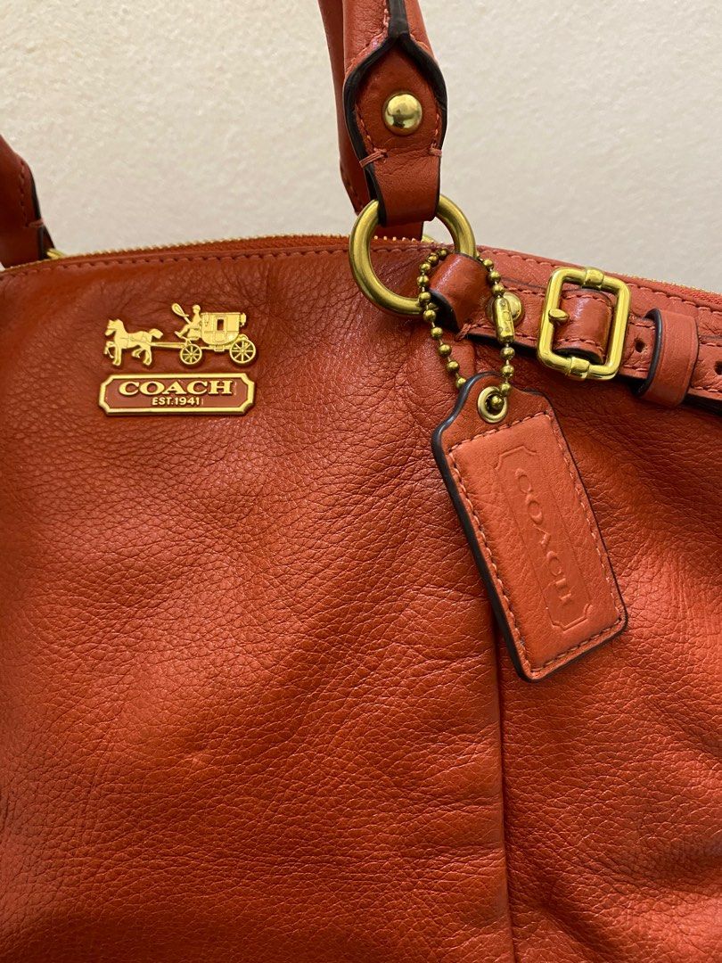 Orange leather hotsell coach purse