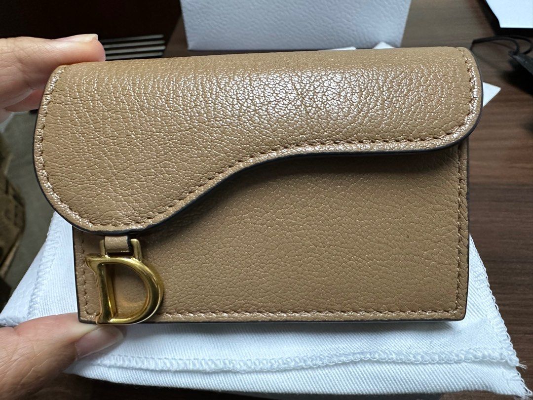 Dior Saddle Card Wallet (Category: Luxury Bags & Wallets) located in Manila. Submitted by dannyp123 (Listing ID 1279506308, Image 1). Description: Dior Saddle Goatskin Card Holder Medium Tan Purchased in HK Opened box and packaging only to check item; never used Comes with box, paper bag, dust bag, ribbon, tag.