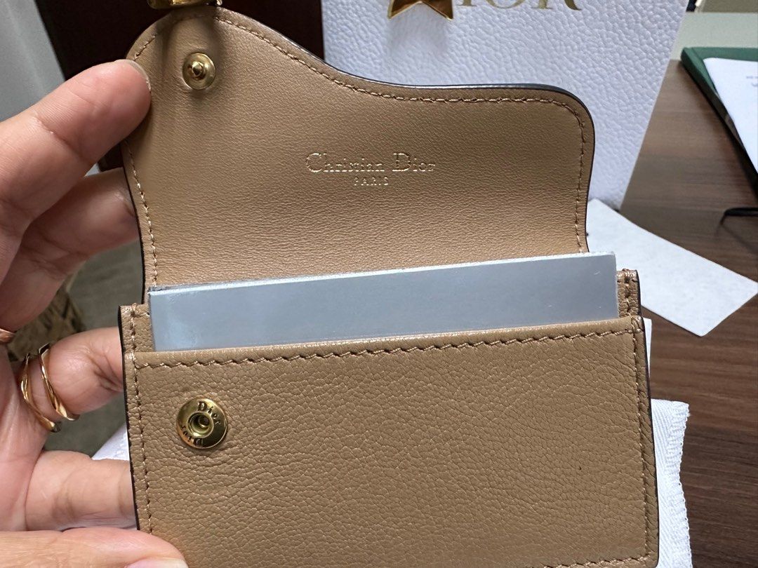 Dior Saddle Card Wallet (Category: Luxury Bags & Wallets) located in Manila. Submitted by dannyp123 (Listing ID 1279506308, Image 3). Description: Dior Saddle Goatskin Card Holder Medium Tan Purchased in HK Opened box and packaging only to check item; never used Comes with box, paper bag, dust bag, ribbon, tag.