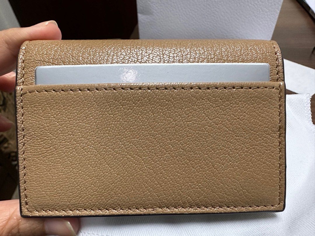 Dior Saddle Card Wallet (Category: Luxury Bags & Wallets) located in Manila. Submitted by dannyp123 (Listing ID 1279506308, Image 2). Description: Dior Saddle Goatskin Card Holder Medium Tan Purchased in HK Opened box and packaging only to check item; never used Comes with box, paper bag, dust bag, ribbon, tag.