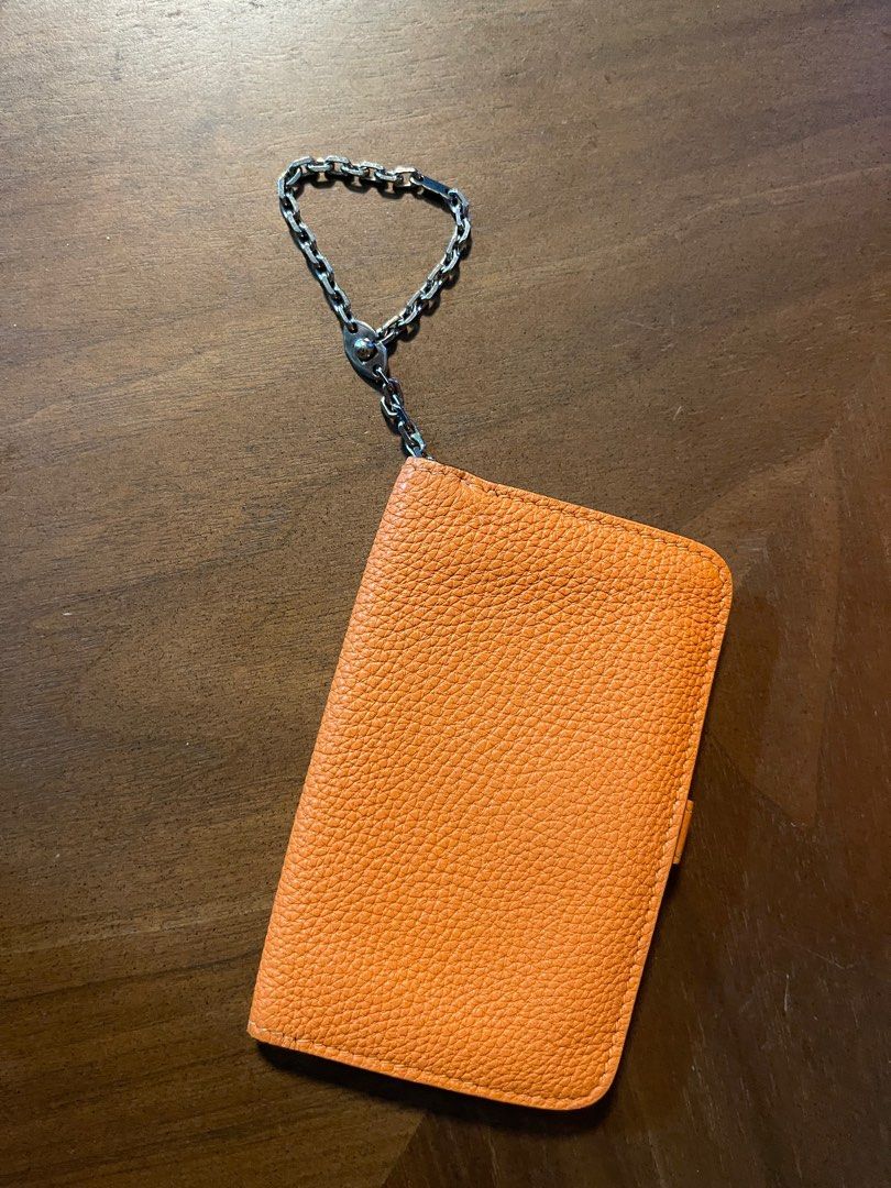 Hermes Dogon cardholder (Category: Luxury Bags & Wallets) located in Quezon City. Submitted by klosetmanila (Listing ID 1279606517, Image 3). Description: Classic H orange, clemence leather No box, with paper bag only Business card for size reference Has gussets on the side, accommodates lots of cards .