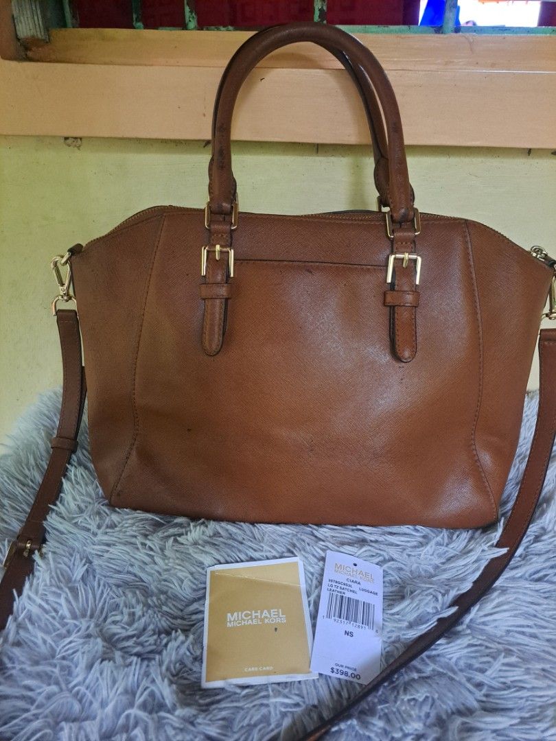 Michael Kors Ciara Satchel Bag (Category: Luxury Bags & Wallets) located in Legazpi City. Submitted by shabbyshibbi (Listing ID 1279573121, Image 2). Description: large size ciara satchel color brown/tan with signs of usage to handle and body but not noticable when worn selling low already with price tag and care card.