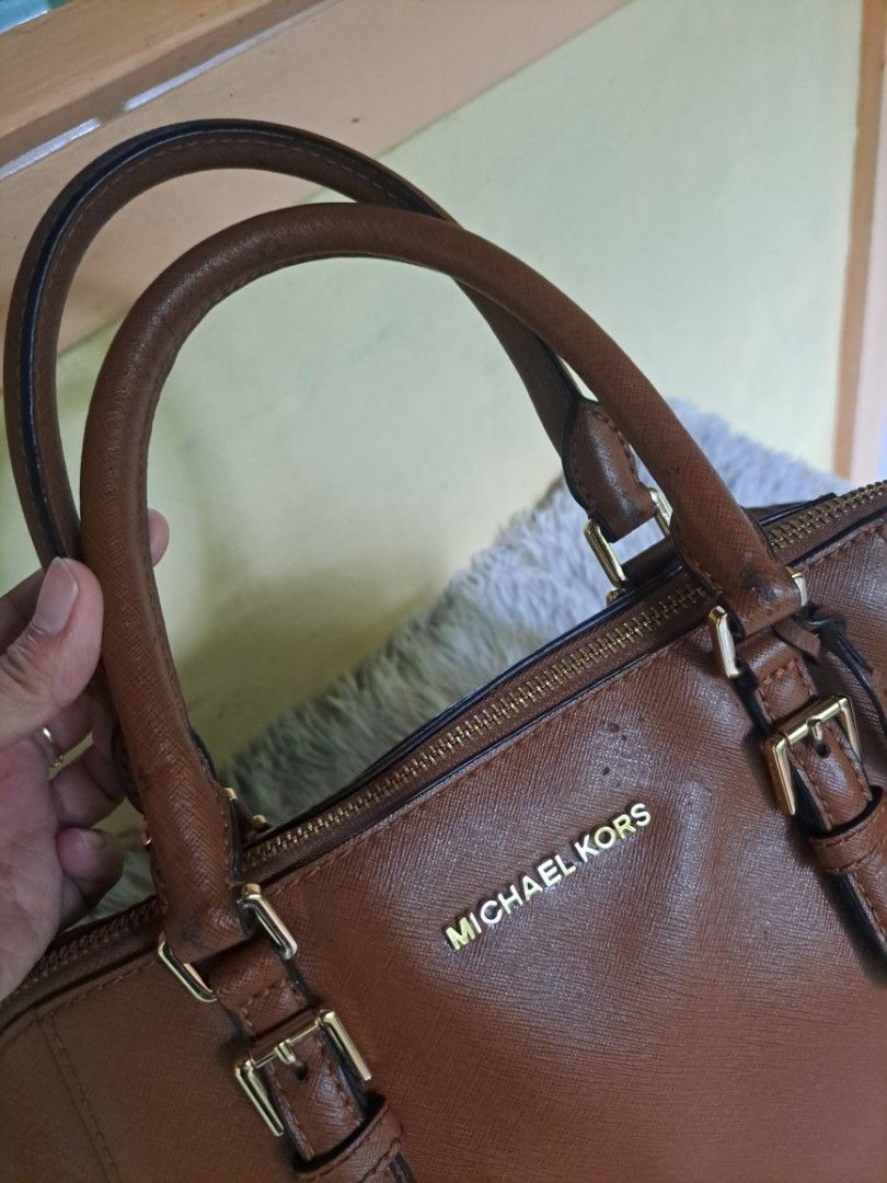 Michael Kors Ciara Satchel Bag (Category: Luxury Bags & Wallets) located in Legazpi City. Submitted by shabbyshibbi (Listing ID 1279573121, Image 3). Description: large size ciara satchel color brown/tan with signs of usage to handle and body but not noticable when worn selling low already with price tag and care card.