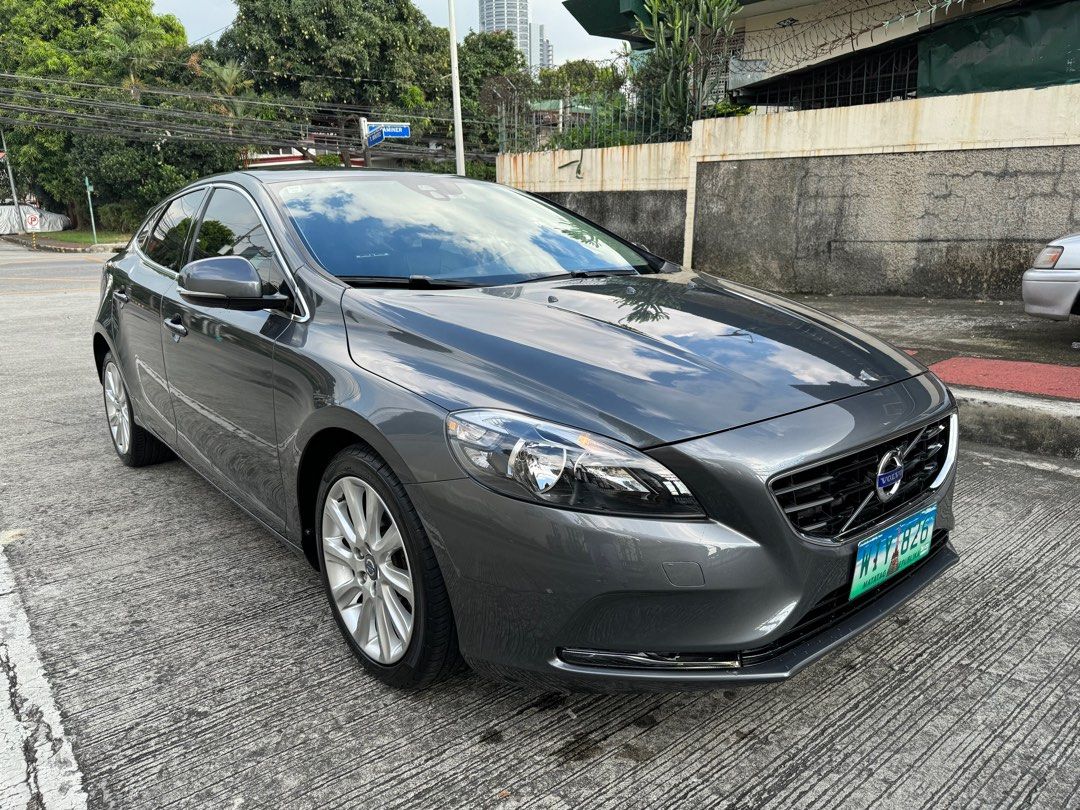 Volvo V40 T4 Turbo Auto (Category: Used Cars) located in Quezon City. Submitted by vincelf (Listing ID 1279503643, Image 1). Description: 2014 Volvo V40 T4 1.6Liters Turbo Gas 6-Speed Automatic Transmission 180-Horsepower Premium Hatchback 1st Own, Color Grey 20TKM Only, All Original Top Condition with Auto-breaking System City Safety + Collision Warning ABS, Curtain Airbags Infotainment Head Unit + Controller Parking Assist + Sensors Dual AC Cli