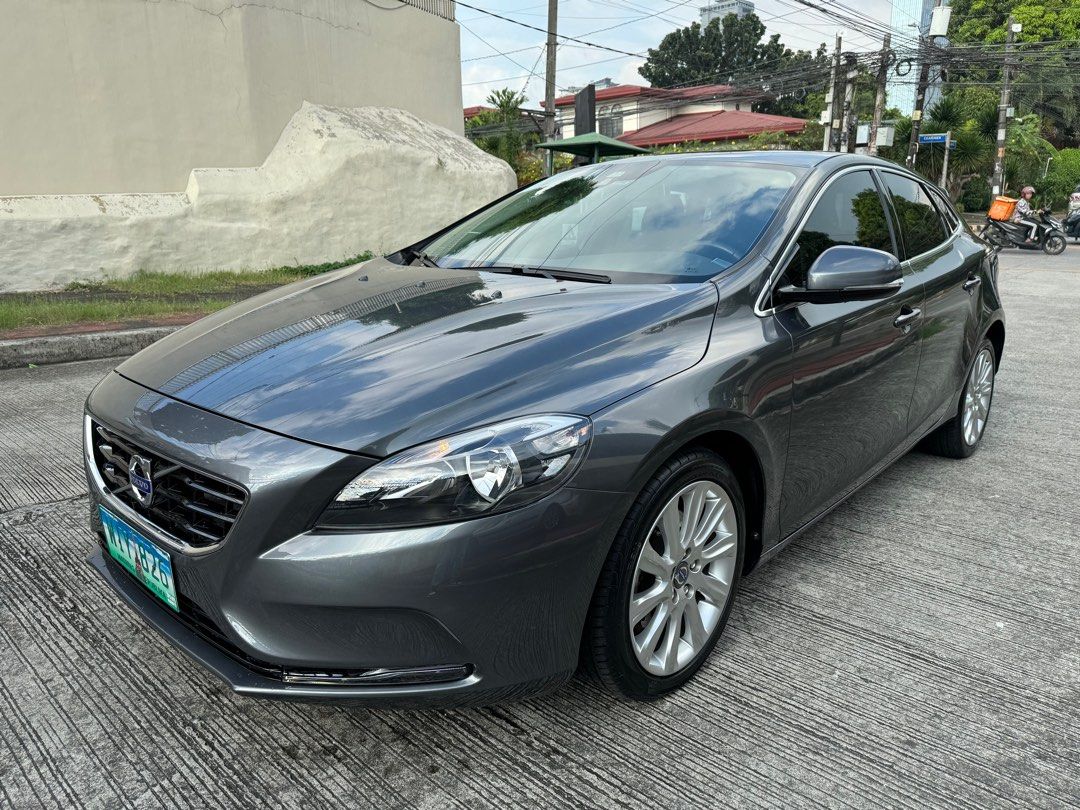 Volvo V40 T4 Turbo Auto (Category: Used Cars) located in Quezon City. Submitted by vincelf (Listing ID 1279503643, Image 2). Description: 2014 Volvo V40 T4 1.6Liters Turbo Gas 6-Speed Automatic Transmission 180-Horsepower Premium Hatchback 1st Own, Color Grey 20TKM Only, All Original Top Condition with Auto-breaking System City Safety + Collision Warning ABS, Curtain Airbags Infotainment Head Unit + Controller Parking Assist + Sensors Dual AC Cli