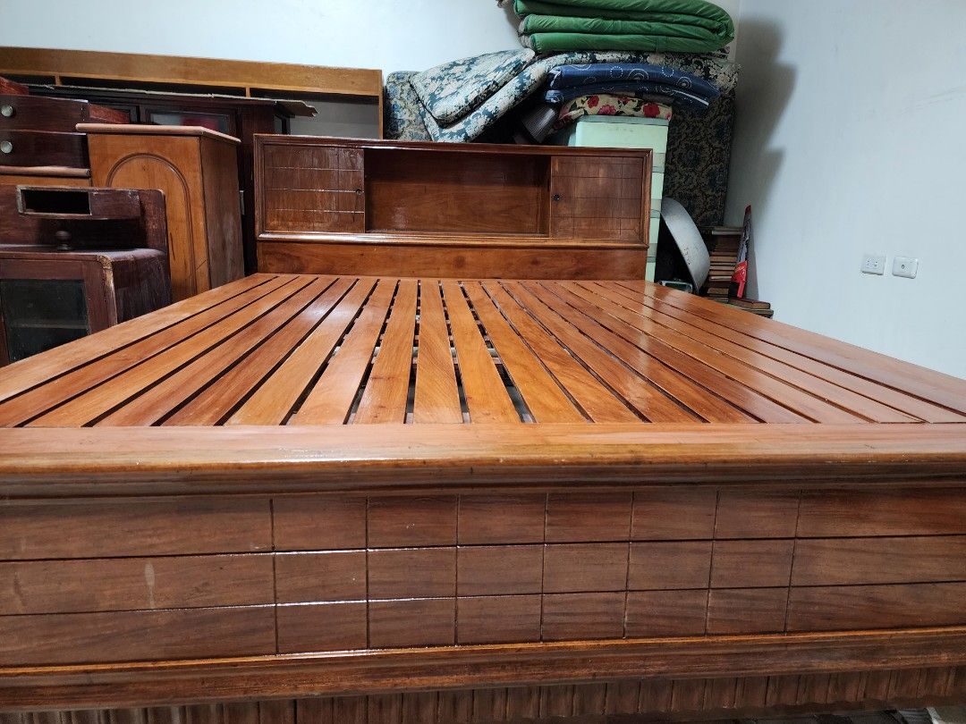 Bed (Category: Bed Frames & Mattresses) located in Quezon City. Submitted by jaluaguevillanueva (Listing ID 1279763829, Image 2). Description: solid hard wood bed with attached headboard cabinet and side table.