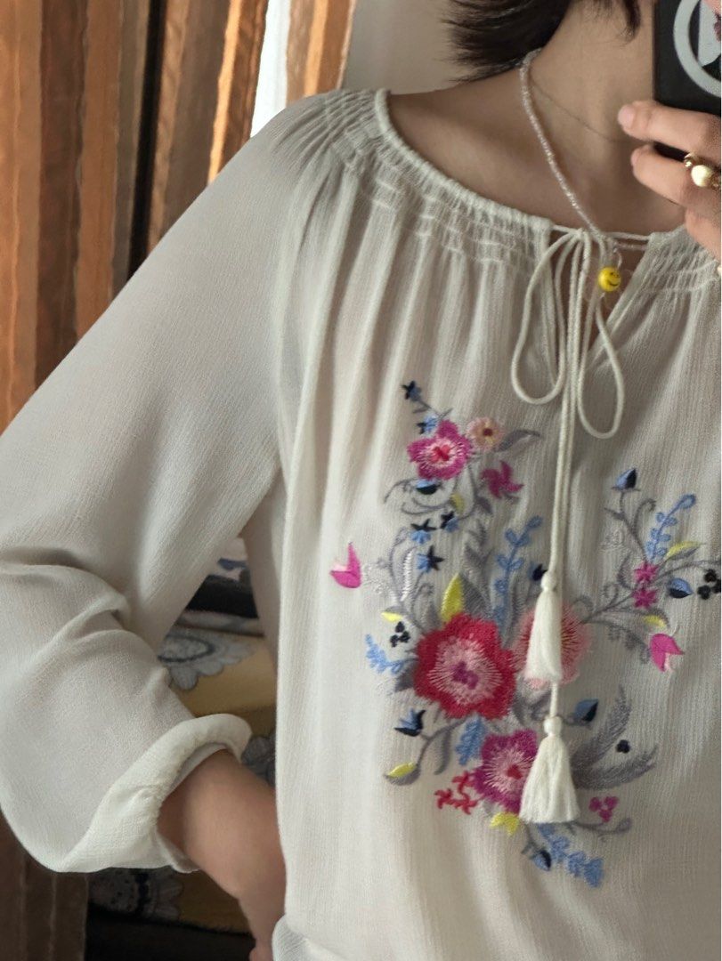 Sheer embroidered top (Category: Blouses) located in Mandaluyong City. Submitted by tenohthree (Listing ID 1279894900, Image 3). Description: Very airy top good for a cover up or wear a skintone tank underneath. Cute for sunny days. Fits S-M.