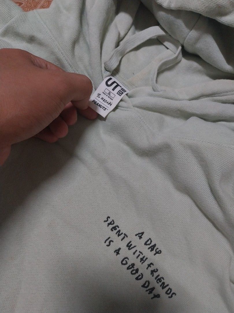 Uniqlo x Peanuts Hoodie (Category: Coats, Jackets and Outerwear) located in Zamboanga. Submitted by thekeepersph (Listing ID 1279774306, Image 2). Description: Uniqlo x Peanuts Width 23.5 | Length 28 Tag: Uniqlo Details: this a collaboration of Uniqlo and Peanuts Issue: Stain.